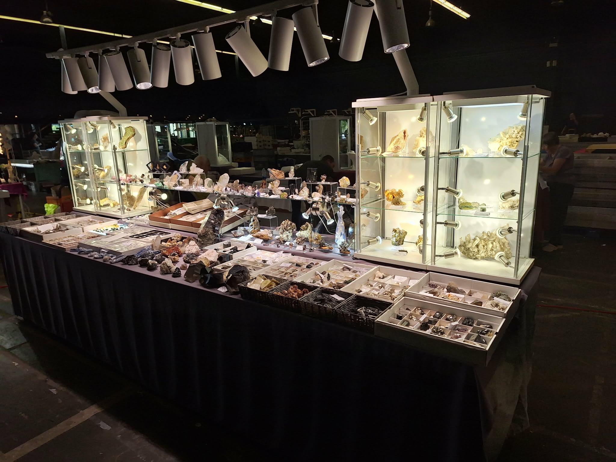 Crystal World exhibition table at mineral fair – panoramic view